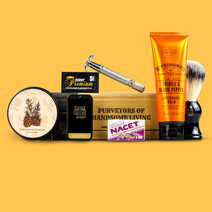The Personal Barber Shaving Club Subscription Box October 2023 Selection featuring shaving cream, post-shave balm, solid cologne and 10 replacement razorblades
