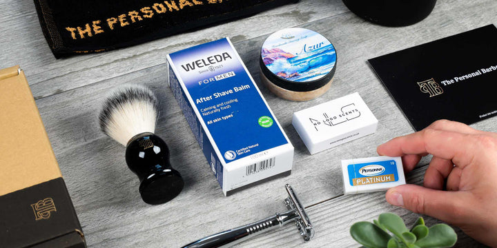 The Personal Barber shaving club example selection of male grooming products. Features safety razor, shaving brush, aftershave balm, shaving soap, solid cologne and double-edge razors