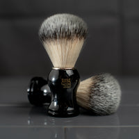 The Personal Barber Synthetic Hair Shaving Brush with black handle, gold logo and chrome collar